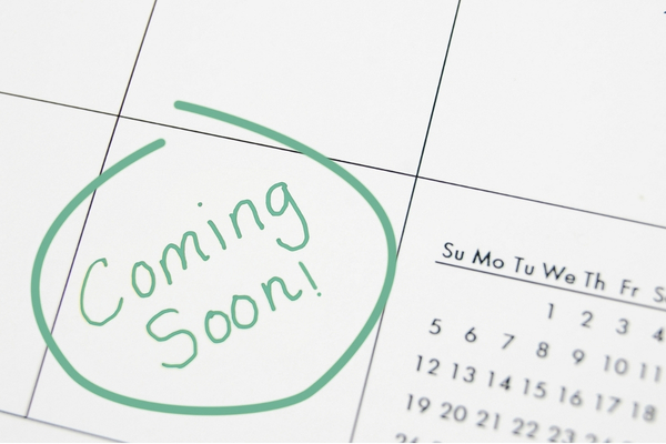 A calendar with the writing "Coming soon!" in green pen